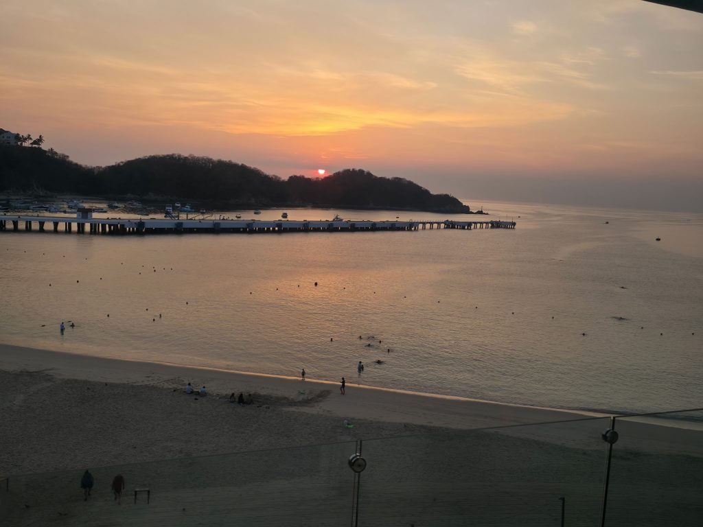 Overlooking a sunset at a beach.
